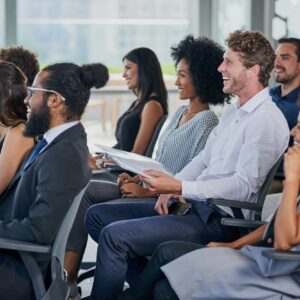 Corporate, development and seminar with business people in conference room for learning or training. Education, event or workshop with man and woman employee group in audience or crowd at office